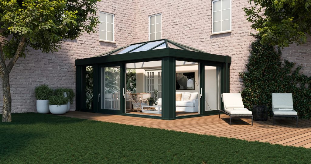 Beautifully designed conservatory attached to a house, featuring a seamless blend of brickwork and glass panels, with a pitched roof and elegant design that enhances the overall aesthetic of the home.