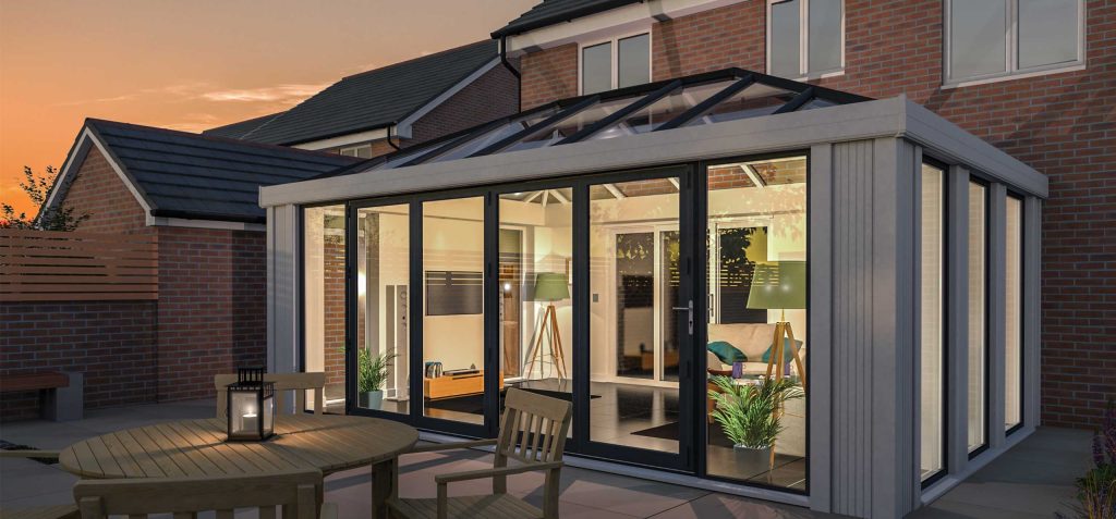 Modern conservatory with glass walls and sleek design in Newcastle, showcasing a contemporary style and seamless integration with the home's exterior