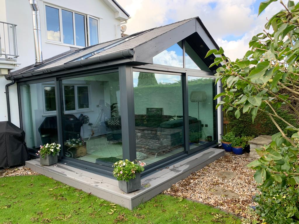 Modern gable end conservatory with floor to roof glass