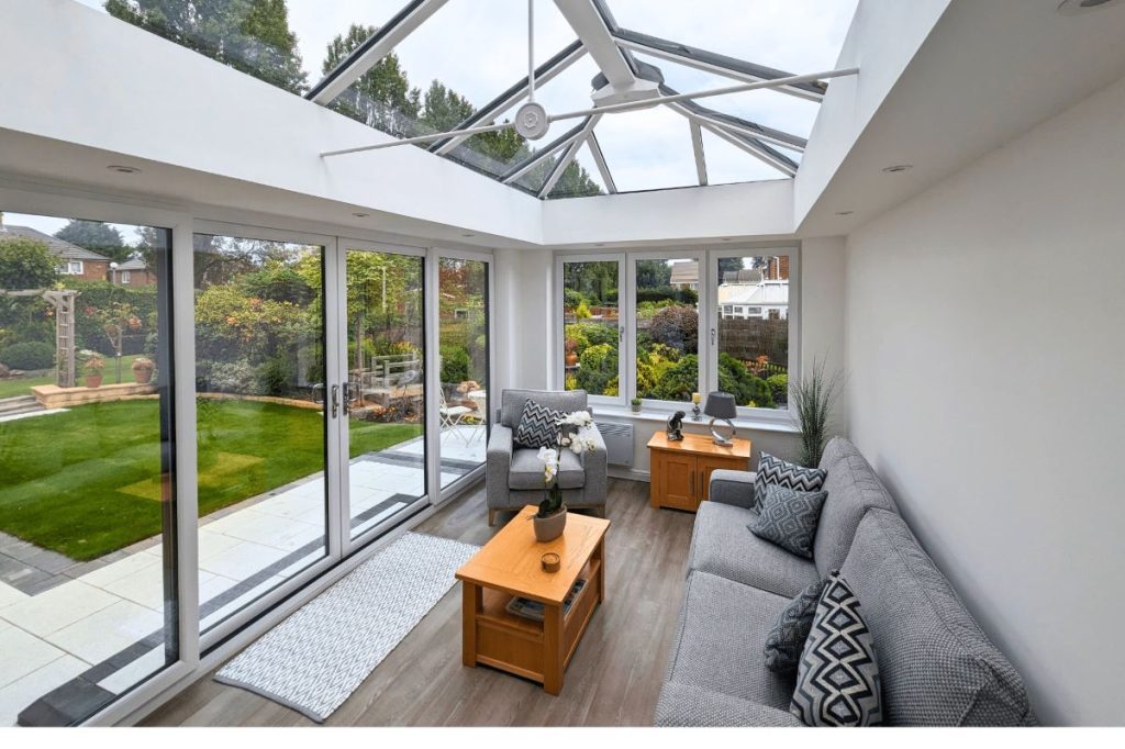 inside view of modern glazed conservatory with sliding doors