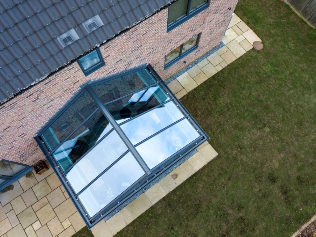 birds eye view of a glass roof gable end conservatory