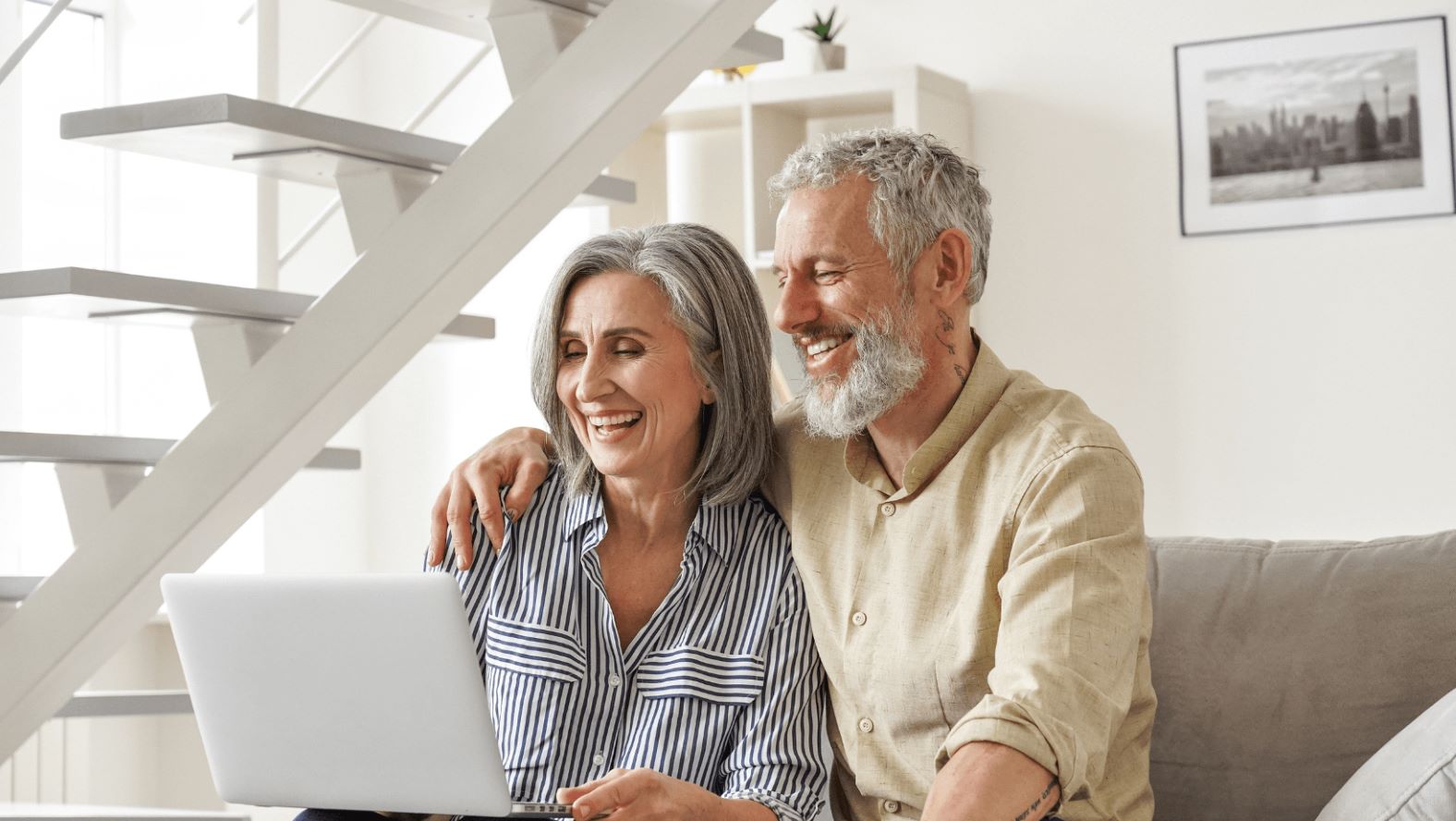 stock photo of couple looking at a laptop