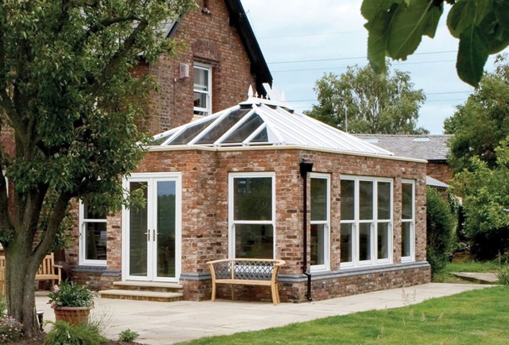 traditional orangery with white upvc french doors