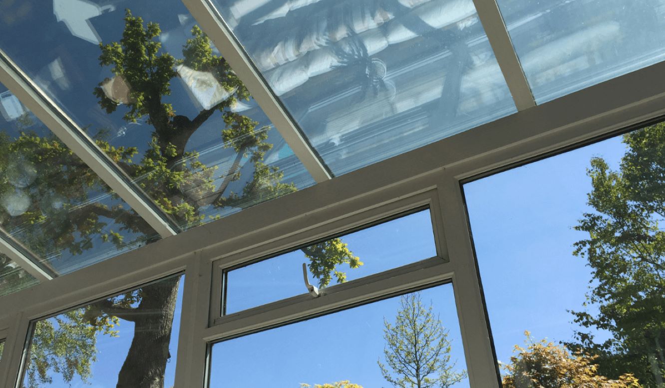 upwards view of a glass roof upvc conservatory